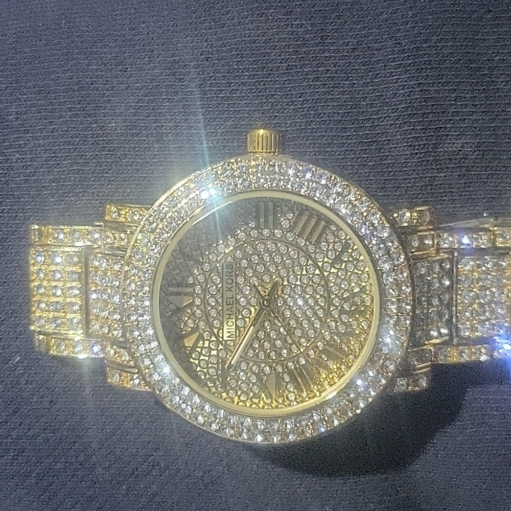 Woman gold Michael kors watch
